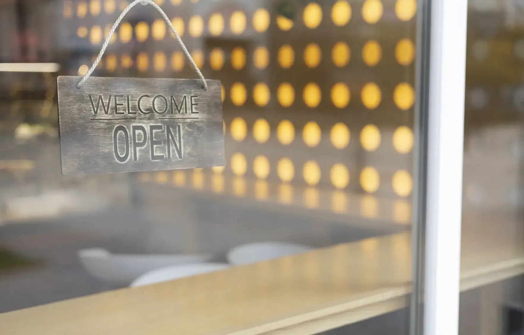 The tranquil and inviting reception area of a luxury spa with warm, diffused lighting and a serene, minimalist design.