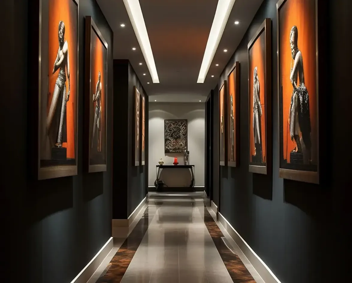 A modern art gallery-style hallway with dramatic accent lighting, a dark color palette, and wall-mounted art displays.