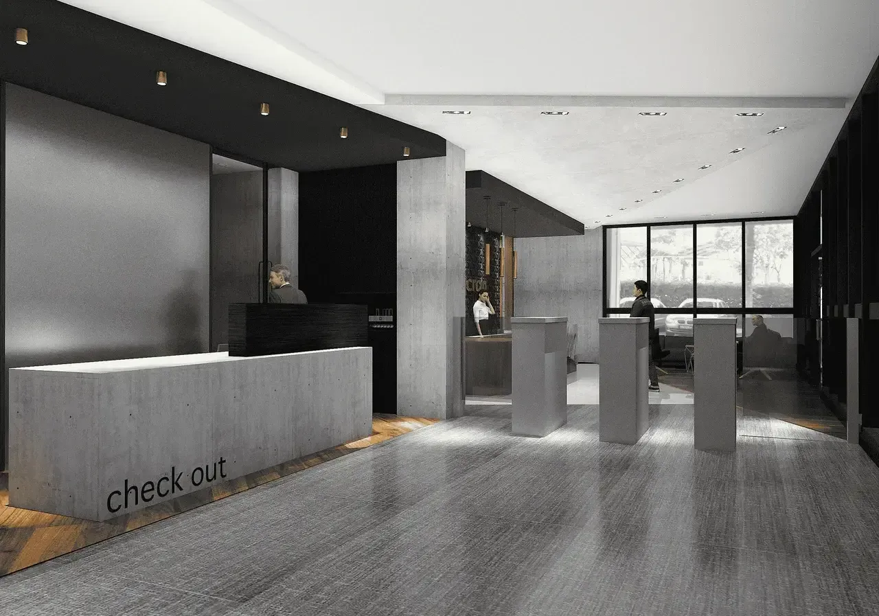 A sleek, modern corporate reception area with concrete floors and a custom-designed desk, showcasing a minimalist aesthetic.